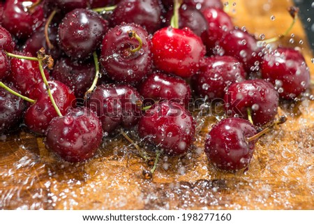 cherries are washed under running water