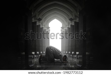 Religious asian muslim man praying Royalty-Free Stock Photo #1982773112