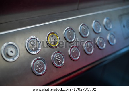 Buttons in the elevator with Braille code for blind people