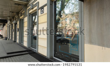 shop window with fashionable clothes in modern city, banner