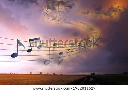 View of beautiful stormy sky with flying music notes