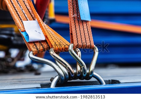 the cargo is held by tension safety belts with mechanical locks Royalty-Free Stock Photo #1982813513