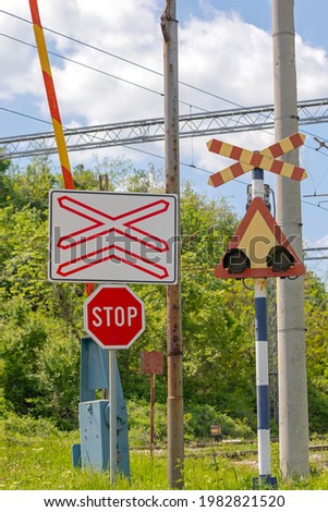 Stop Sign at Railway Level Crossing Warning