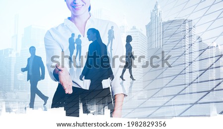 Office woman with extended hand smiling, toned image. Skyscrapers and diverse business partners silhouettes, office buildings double exposure. Concept of agreement and team