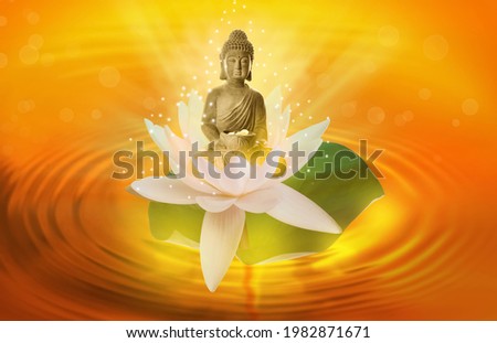 Beautiful composition with Buddha sculpture and lotus flower on water surface