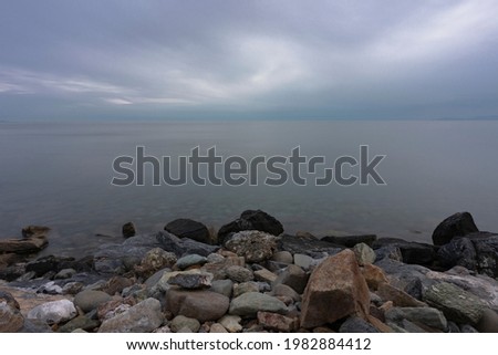 long exposure sea photo taken over rocks by the sea greece maronia