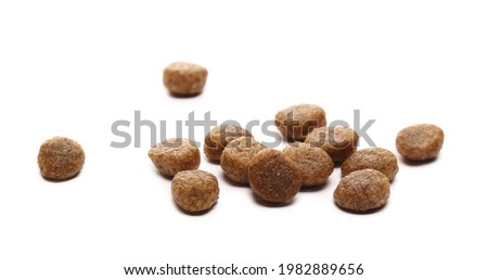 Dog food pile, dry granules for puppies and young dogs isolated on white background Royalty-Free Stock Photo #1982889656