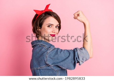 Photo of young smiling beautiful confident cool woman showing muscles powerful isolated on pink color background Royalty-Free Stock Photo #1982895833