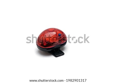 Bicycle taillight. Used bicycle taillight on an isolated white background. Selective focus. Space for text