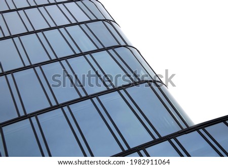 Double exposure photo of glass wall reflecting sky. Abstract modern architecture background. Office building exterior. Geometric structure with rectangular ornament of panels.