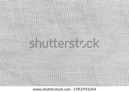 Background Texture of white medical bandage. cheesecloth texture Royalty-Free Stock Photo #1982941064
