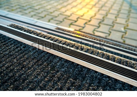 Closeup of ceramic tiles covering porch stairs with rubber anti slippery stripes on it. Royalty-Free Stock Photo #1983004802