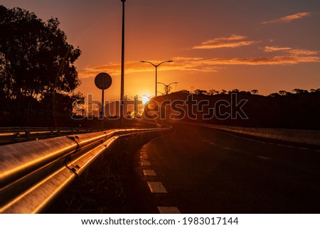 sun setting on highway during summer times in Mauritius.