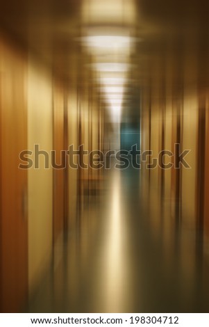 The abstract photograph of a long corridor floor of an office building / Long floor abstract              