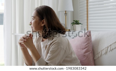 Unhappy Female employee latin mom think sit sofa couch at home living room need help support panic coronavirus financial debt crisis in life insurance feel pain distress pensive regret lost upset. Royalty-Free Stock Photo #1983083342