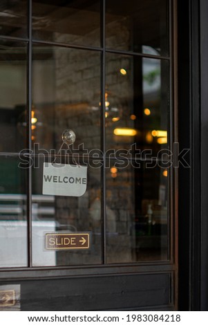 Welcome sign outside a restaurant, store, office or other