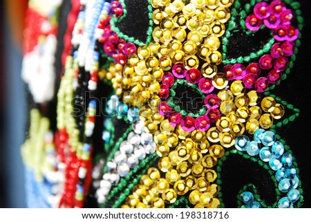Close up on Murut costume flower pattern. A Murut lady costume has colorful pattern and worn by Murut ladies during festivities.