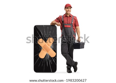 Mobile phone repair technician leaning on a smartphone with a broken screen and bandage isolated on white background