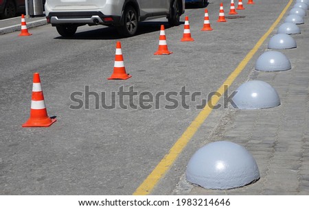    Devices for temporary road markings.                            