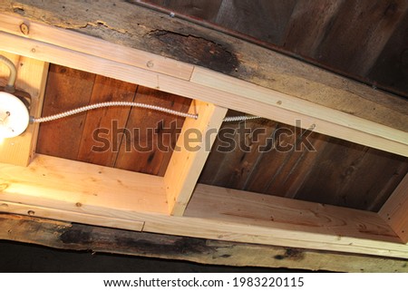 Termite-Damaged Floor Joists Reinforced with Sistering Royalty-Free Stock Photo #1983220115