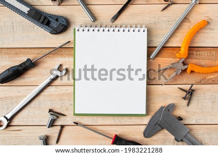 Set of work tools on a wooden background. Festive greeting card concept for Father's day