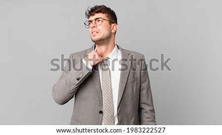 businessman feeling stressed, anxious, tired and frustrated, pulling shirt neck, looking frustrated with problem