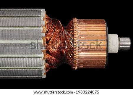 Rotor or of anchor electric motor closeup, isolated on black background