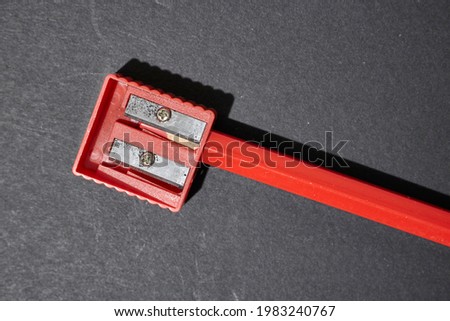 A studio photo of a pencil sharpener