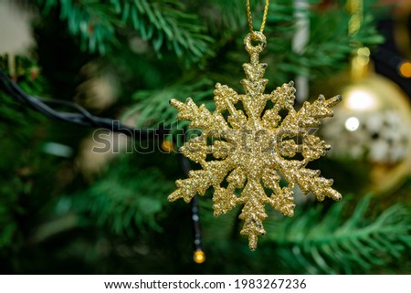 snowflakes decorated on pine tree for Christmas celebration.