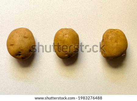 A picture of three potatoes