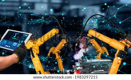 Smart industry robot arms modernization for innovative factory technology . Concept of automation manufacturing process of Industry 4.0 or 4th industrial revolution and IOT software control operation.