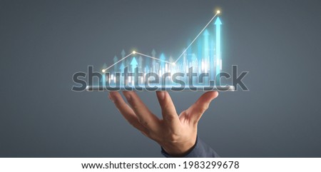 Plan graph growth and increase of chart positive indicators in his business on tablet
