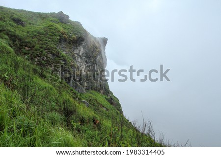 Mountain Peaks covered with fog and cloud in the rainy season. (The Picture has noise and soft focus)