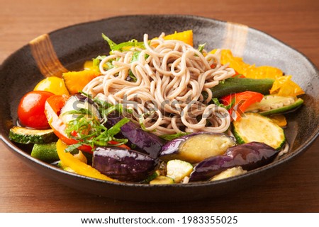 japanese noodles with deep-fried summer vegetables soaked in soy sauce soup stock