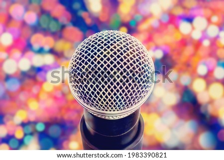 microphone head close-up on colorful bokeh background