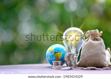 Stacking coins with green bokeh background ,Business Finance and Money concept, Advertising coins of finance and banking