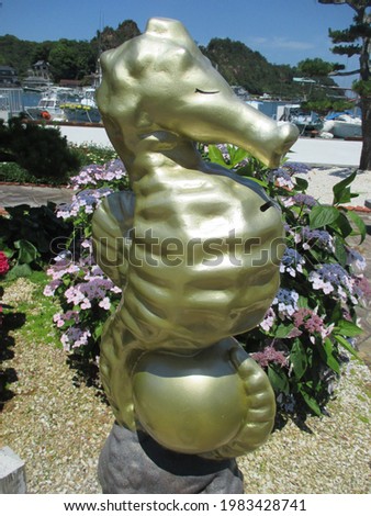 A rare gold seahorse object found on a trip