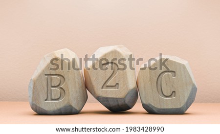 B2C letters inscription on wooden blocks. Business to Consumer commerce concept.