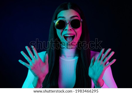 Photo of young excited girl happy positive smile amazed surprised omg wow reactin nightlife isolated over dark color background