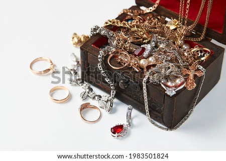 Treasure chest isolated on white background with copy space. Vintage wooden chest with accessory and jewelry, close-up