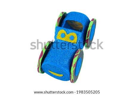 Single nice blue car made with small craft paper and nicely placed on a paper background