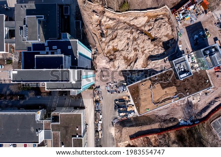 Aerial view of the construction site of the metro station and tall residential building in the Kivenlahti neighborhood of Espoo, Finland.