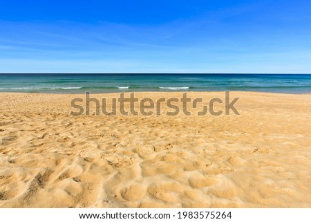 Tropical beach and wave against blue sky background