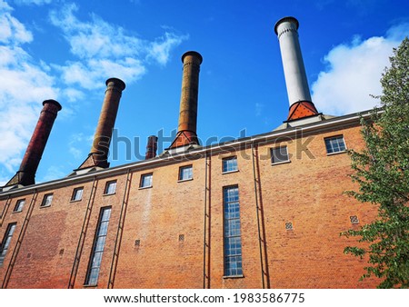 exterior architecture of a factory with 4 towers