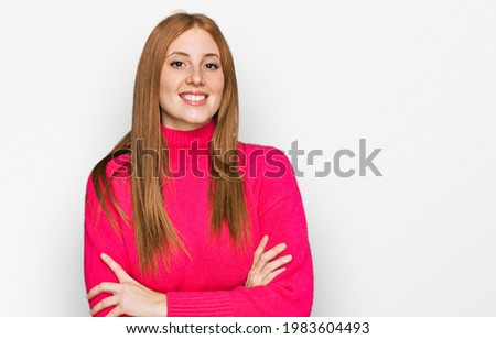 Young irish woman wearing casual clothes happy face smiling with crossed arms looking at the camera. positive person. 