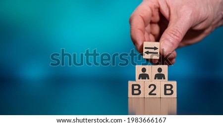 Concept of B2B with icons on wooden cubes Royalty-Free Stock Photo #1983666167