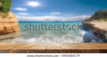 Wooden desk of free space for your decoration and summer beach landscape 