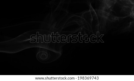 smoke swirls over the black background