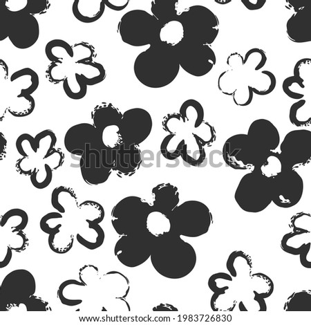 Chamomile flowers. Minimalistic drawing of daisies. Silhouette made by brush stroke with ink. Seamless background with black and white pattern.
