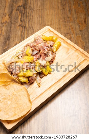 Meat tacos with cheese. Traditional mexican food. Mexican food on wooden background with copy space. Mexican tacos concept.